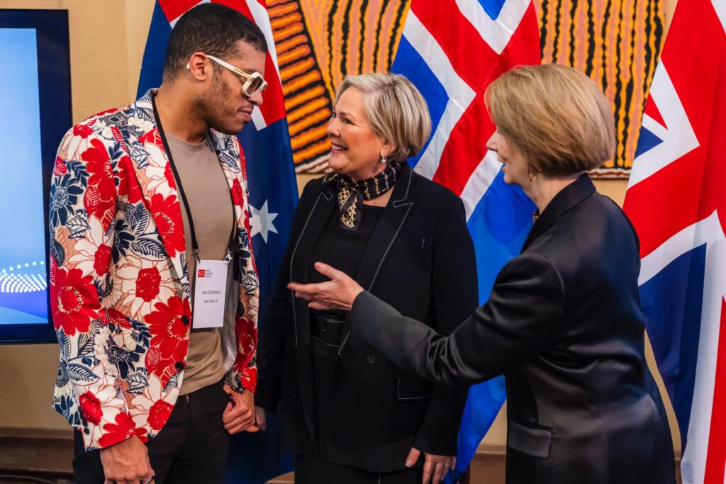 Lee wearing a floral blazer is being introduced to the President of Iceland, Halla Tómasdóttir by former Australian President Julia Gillard.